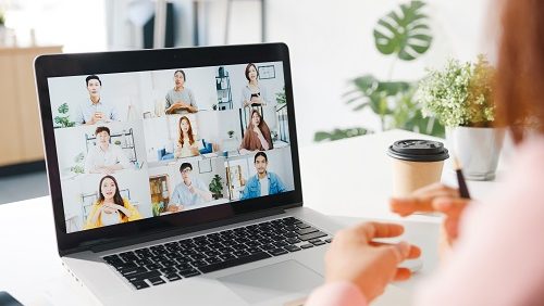 Young Asia businesswoman using laptop talk to colleague about pl